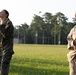 Marines with Marine Corps Combat Service Support Schools maneuver through an obstacle course