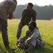 Marines with Marine Corps Combat Service Support Schools maneuver through an obstacle course