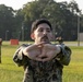 Marines with Marine Corps Combat Service Support Schools maneuver through an obstacle course