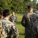 Marines with Marine Corps Combat Service Support Schools maneuver through an obstacle course