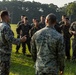 Marines with Marine Corps Combat Service Support Schools maneuver through an obstacle course