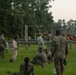 Marines with Marine Corps Combat Service Support Schools maneuver through an obstacle course