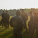 Marines with Marine Corps Combat Service Support Schools maneuver through an obstacle course