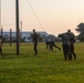 Marines with Marine Corps Combat Service Support Schools maneuver through an obstacle course