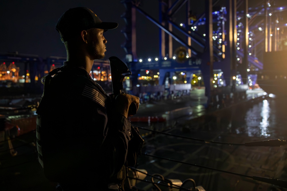 USS Spruance Sailor stands armed watch