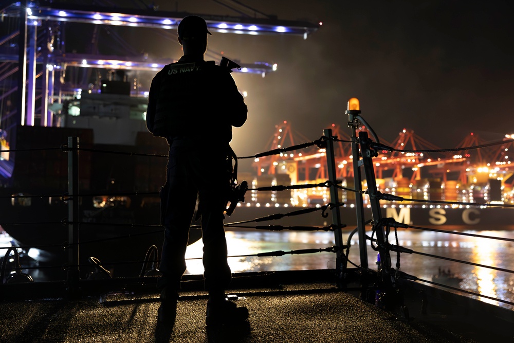 USS Spruance Sailor stands armed watch