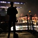 USS Spruance Sailor stands armed watch