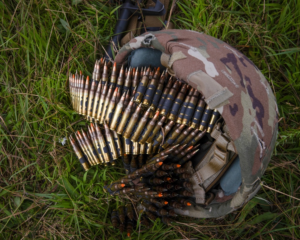 U.S. Army National Guard soldiers fire M249s at the 2024 National Best Warrior Competition