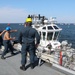 Sailors aboard the USS Howard conduct a sea and anchor detail in Yokosuka, Japan