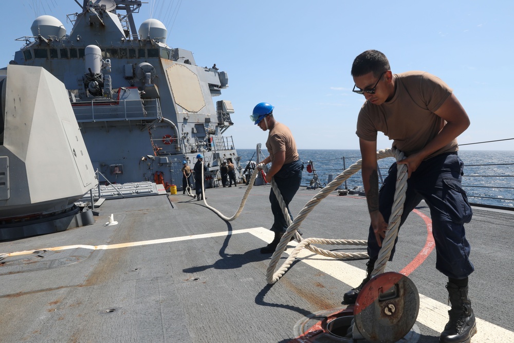 Sailors aboard the USS Howard conduct a sea and anchor detail in Yokosuka, Japan