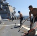 Sailors aboard the USS Howard conduct a sea and anchor detail in Yokosuka, Japan