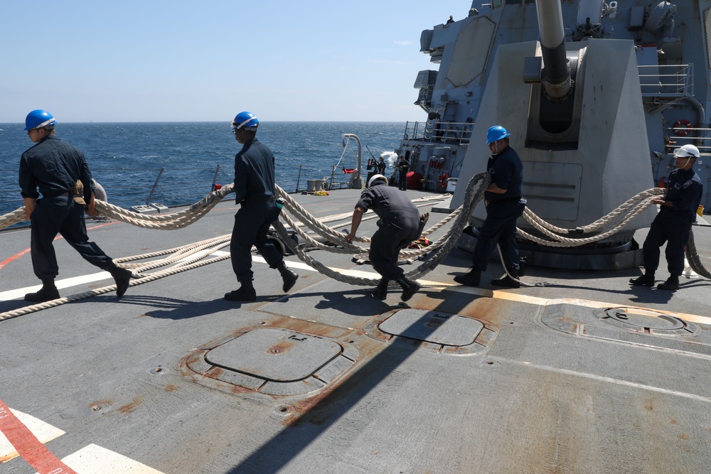 Sailors aboard the USS Howard conduct a sea and anchor detail in Yokosuka, Japan