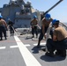 Sailors aboard the USS Howard conduct a sea and anchor detail in Yokosuka, Japan
