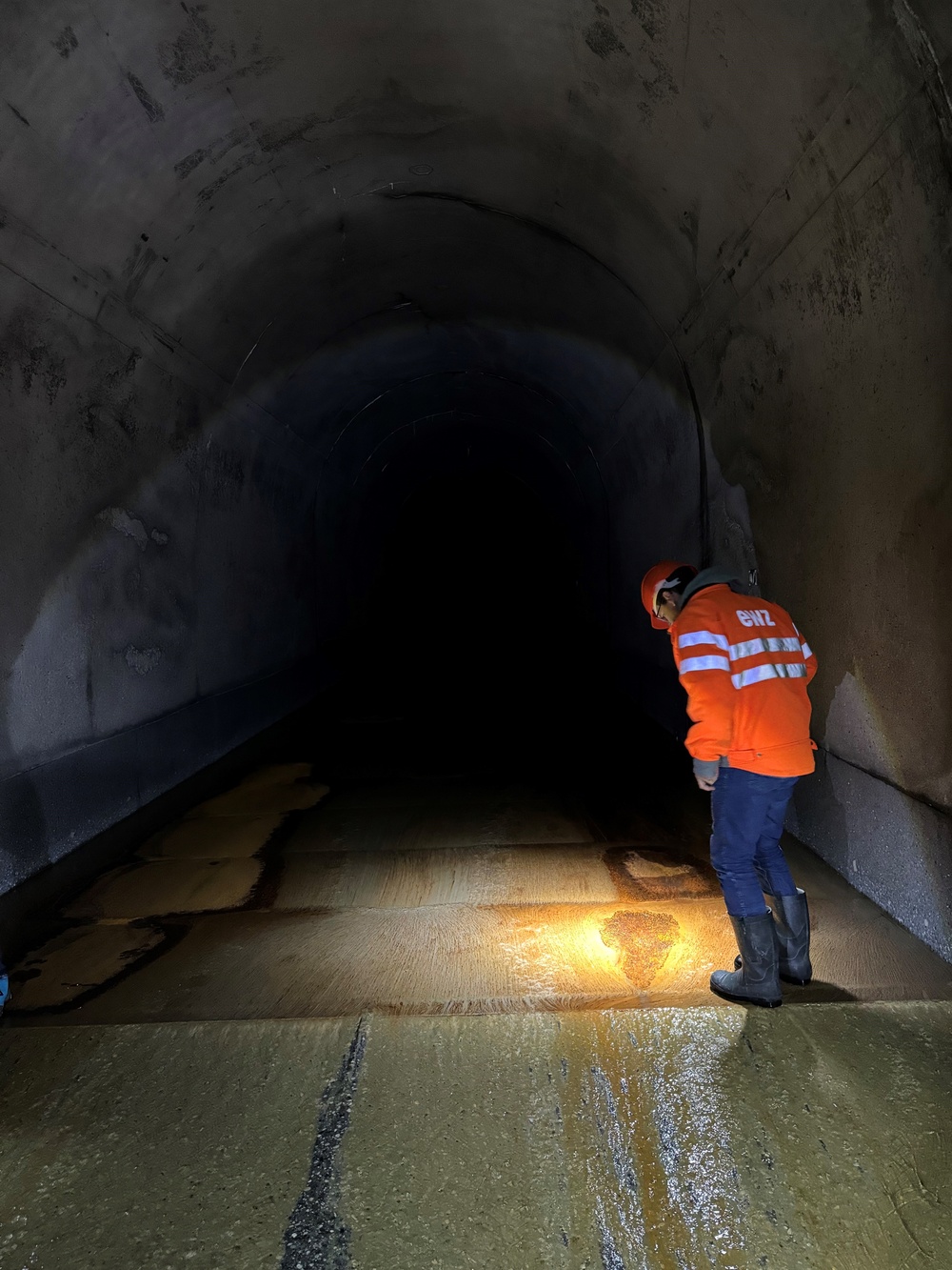 Swiss engineer investigates a worn area in the Solis sediment bypass tunnel