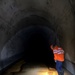 Swiss engineer investigates a worn area in the Solis sediment bypass tunnel