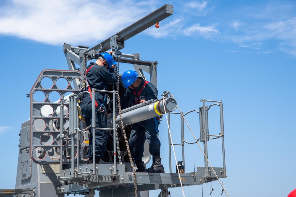 USS San Diego loads ordinance