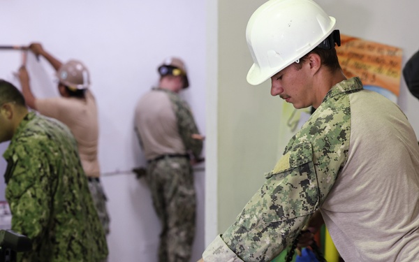 Continuing Promise 2024 Seabees renovate a building at Centro Reintegra in Colón, Panama