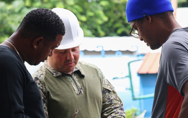 Continuing Promise 2024 Seabees renovate a building at Centro Reintegra in Colón, Panama
