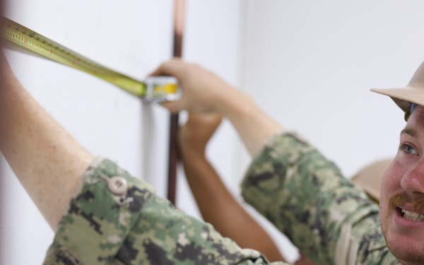 Continuing Promise 2024 Seabees renovate a building at Centro Reintegra in Colón, Panama