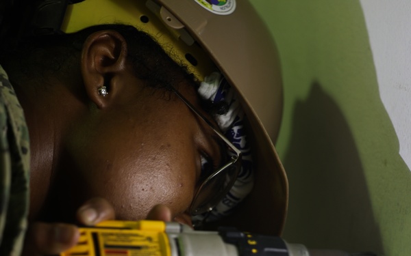 Continuing Promise 2024 Seabees renovate a building at Centro Reintegra in Colón, Panama