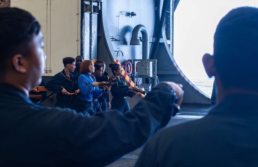 USS George Washington Sailors conduct training in the hangar bay