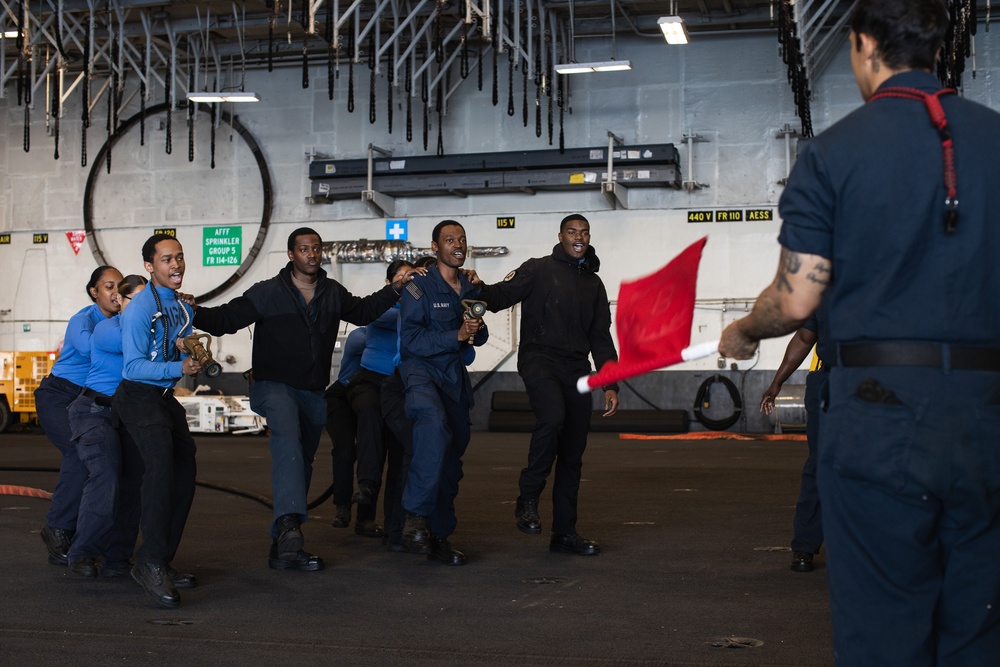 USS George Washington Sailors conduct training in the hangar bay
