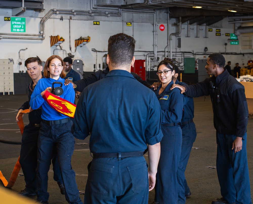 USS George Washington Sailors conduct training in the hangar bay