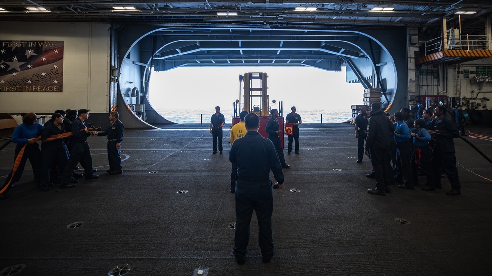 USS George Washington Sailors conduct training in the hangar bay