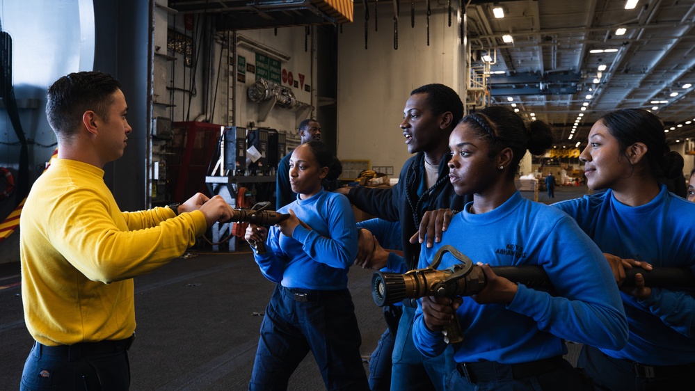 USS George Washington Sailors conduct training in the hangar bay