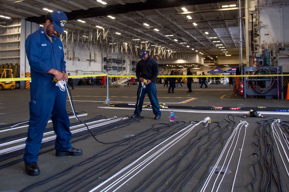 USS Ronald Reagan (CVN 76) Sailors inspect equipment
