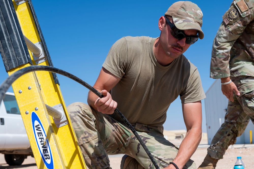 332 AEW Airmen install fiber optic internet