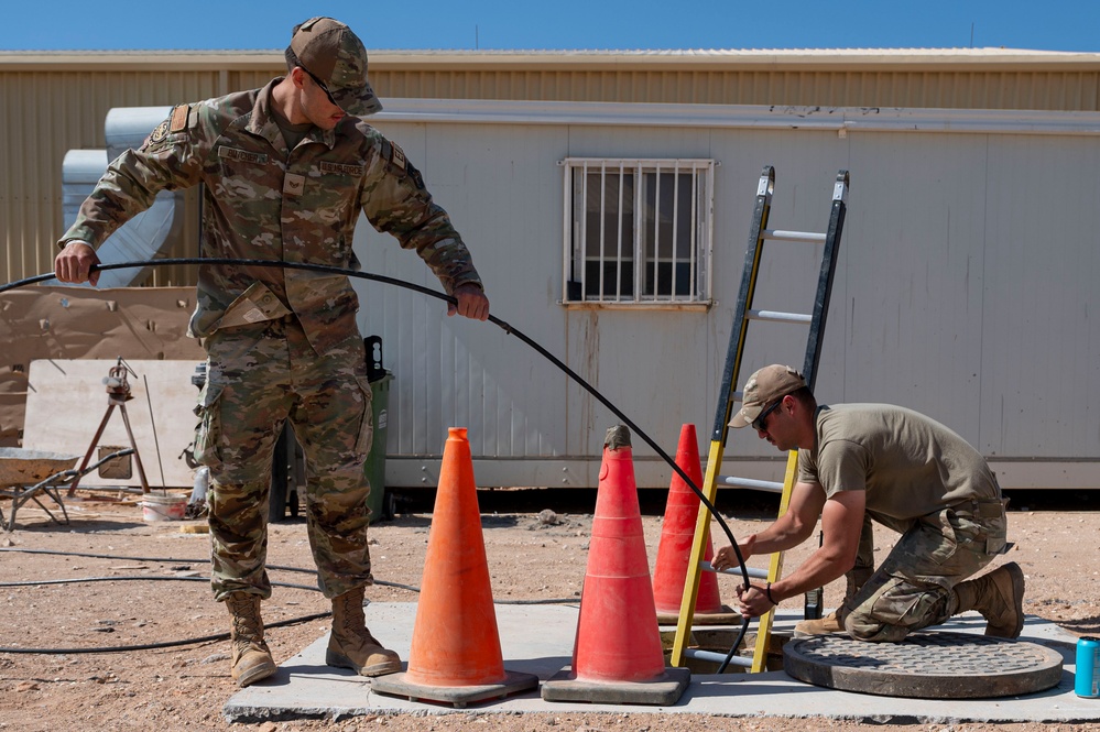 332 AEW Airmen install fiber optic internet