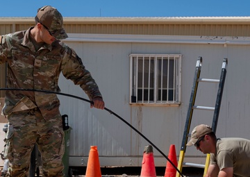 332 AEW Airmen install fiber optic internet