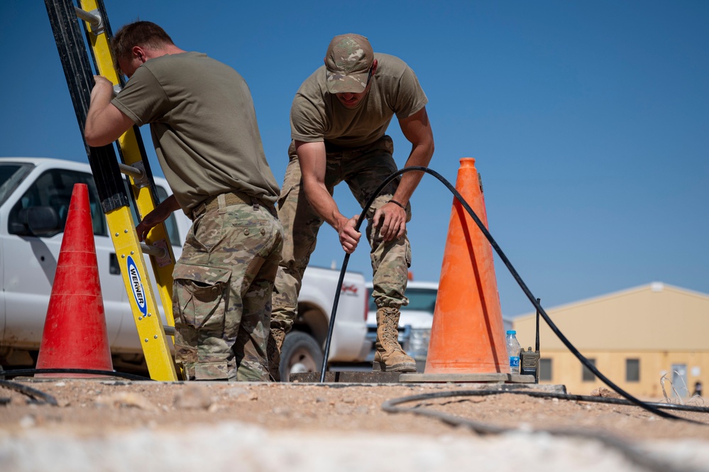 332 AEW Airmen install fiber optic internet