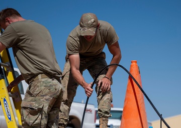 332 AEW Airmen install fiber optic internet
