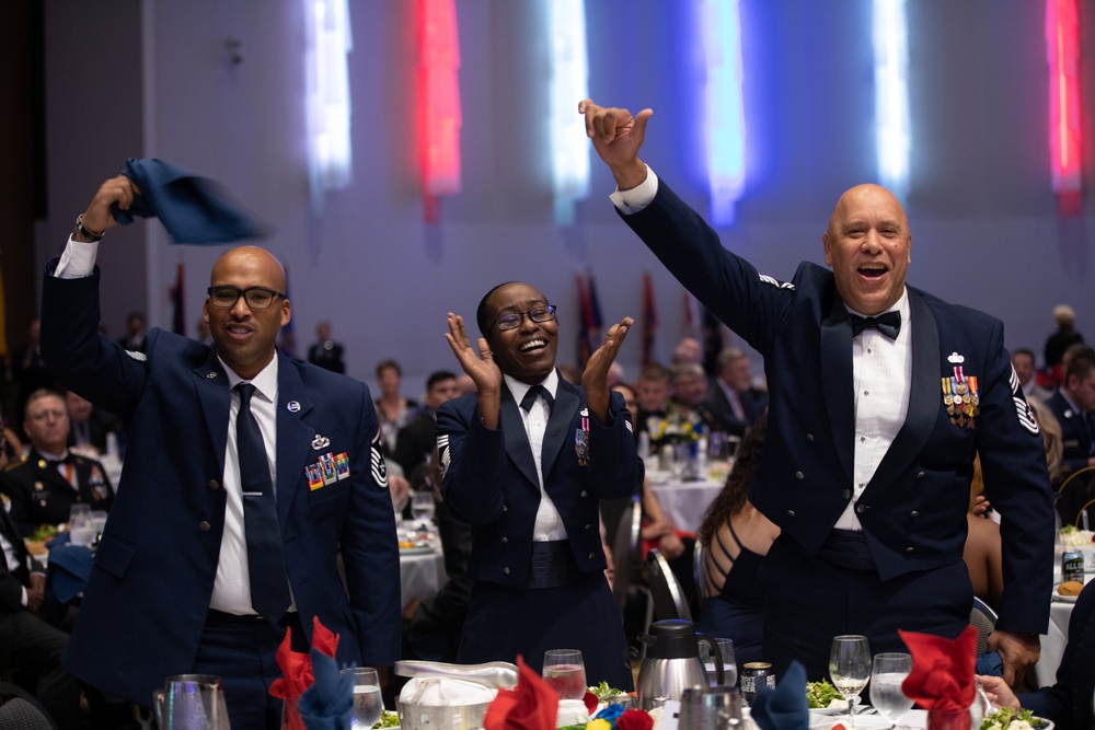 Louisiana Air National Guardsmen Cheer for Their State Flag Bearer During the EANGUS All States Banquet