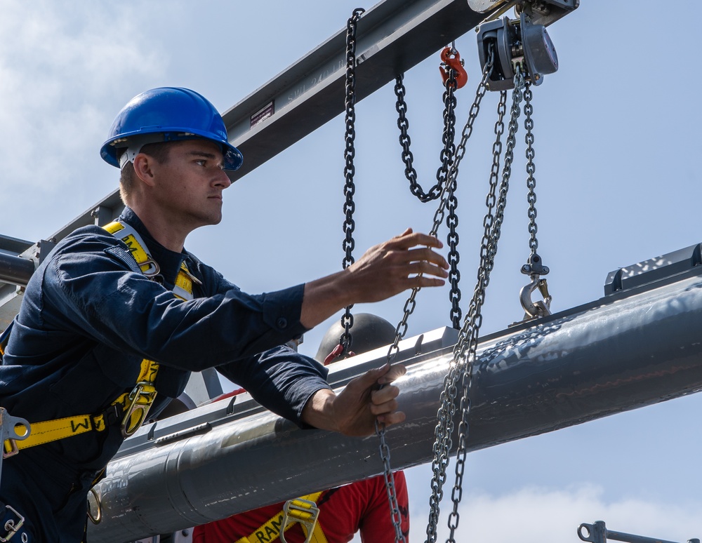 USS George Washington Sailors download rolling airframe missiles
