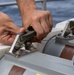USS George Washington Sailors download rolling airframe missiles