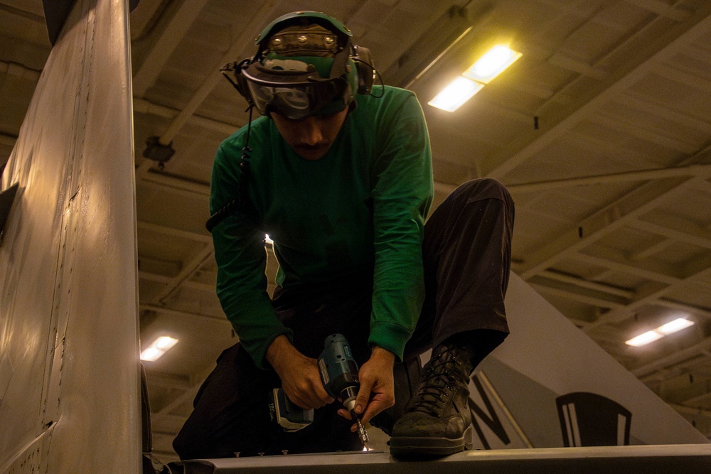 Sailor conducts maintenance aboard Abraham Lincoln