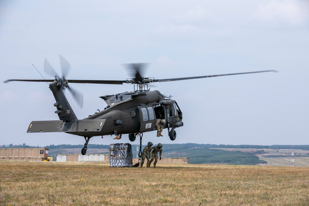 U.S. Army Soldiers conduct sling load training at Camp Bondsteel Kosovo.