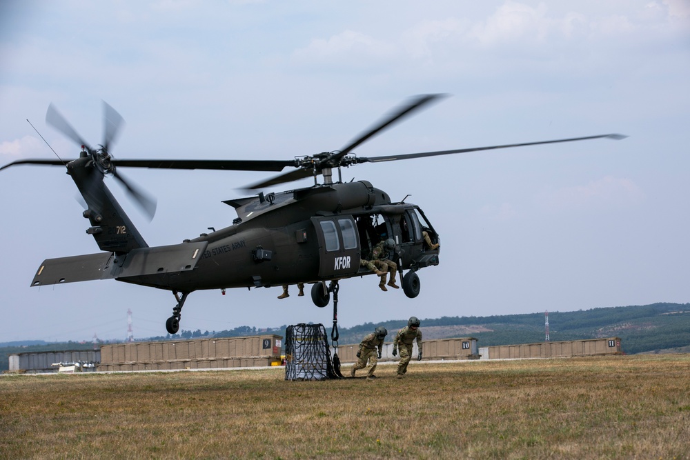 U.S. Army Soldiers conduct sling load training at Camp Bondsteel Kosovo.