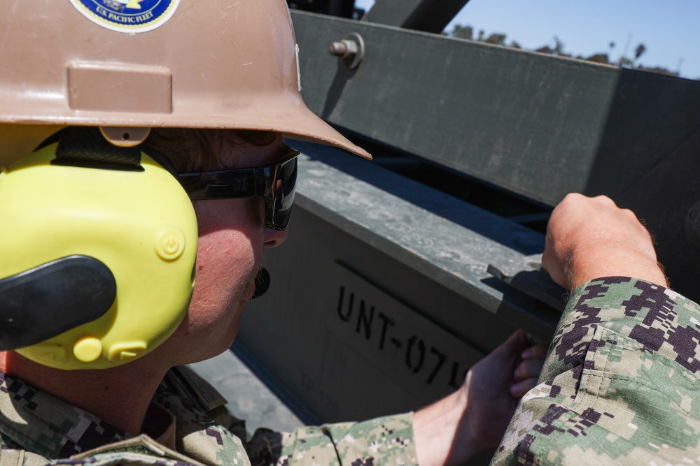 NMCB 4 Seabees Assemble Rock Breaker