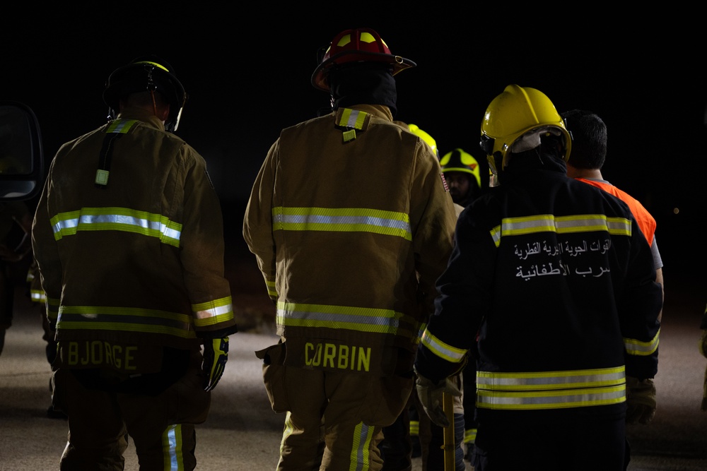 379th ECES firefighters practice vehicle extrication with host nation partners