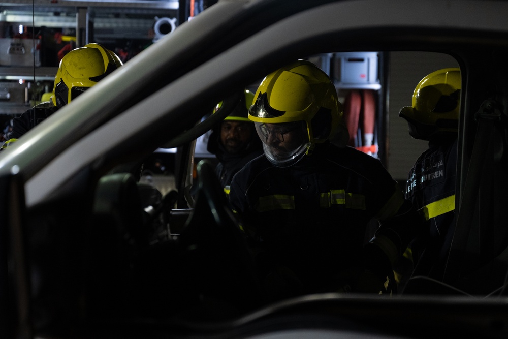 379th ECES firefighters practice vehicle extrication with host nation partners