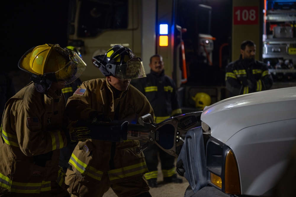 379th ECES firefighters practice vehicle extrication with host nation partners