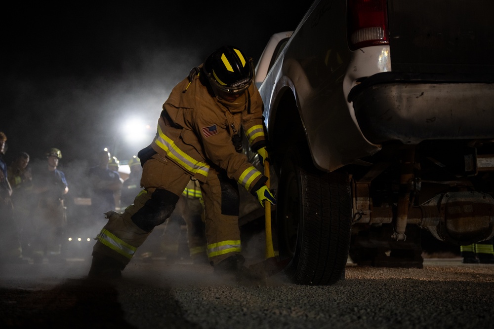 379th ECES firefighters practice vehicle extrication with host nation partners