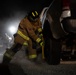 379th ECES firefighters practice vehicle extrication with host nation partners