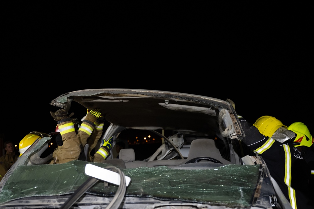 379th ECES firefighters practice vehicle extrication with host nation partners