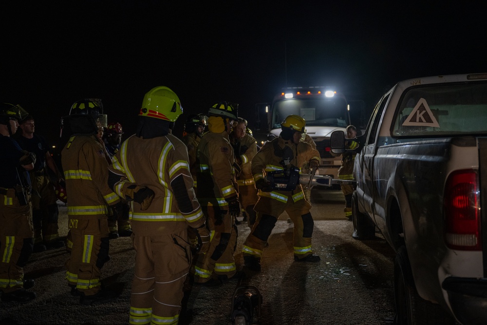 379th ECES firefighters practice vehicle extrication with host nation partners