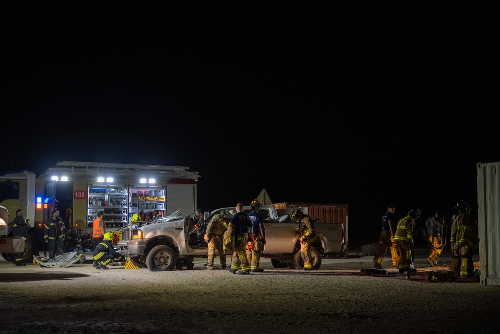 379th ECES firefighters practice vehicle extrication with host nation partners